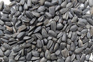 Background of sunflower seeds on a white background.