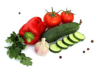 Fresh harvest of vegetables lie on a white background.