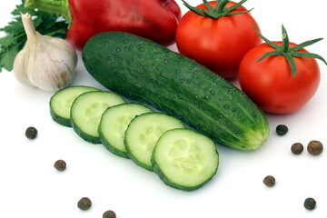 Fresh harvest of vegetables lie on a white background.