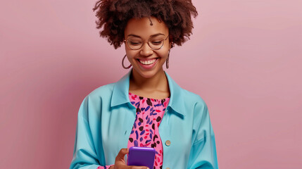 Cheerful Young Woman Texting on Smartphone Against Pink Background