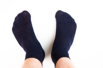 Male feet in socks on a white background. Men's socks.