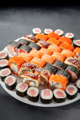 Assorted sushi and maki rolls platter with tuna, salmon, and eel, perfect for a Japanese cuisine experience