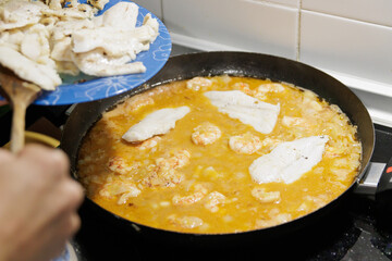 Fish in sauce with shrimp. Step by step preparation. Adding the ingredients