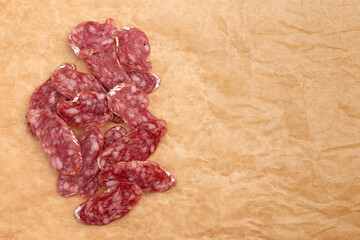 slices of salami on parchment paper