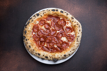 Pizza with salami and mozzarella cheese