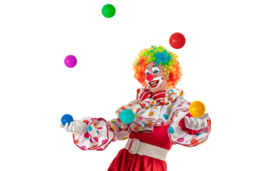Funny clown juggler. Entertainer professional actor in colorful suit and wig juggling with colorful balls. Joker jester, pantomime, mime with clown whiteface makeup at event, kids party, circus