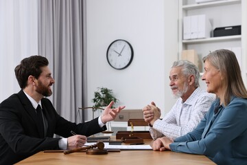 Senior couple having meeting with lawyer in office