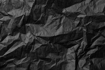 Black crumpled paper as a background.