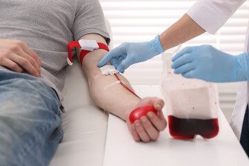 Patient undergoing blood transfusion in hospital, closeup