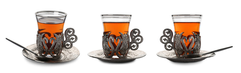 Glasses of traditional Turkish tea in vintage holders isolated on white, set