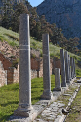 Ancient Roman forum colonnade on the central public space, The Agora, at Sanctuary of Apollo, it was the center of the athletic, artistic, spiritual and political life of the city, Delphi, Greece
