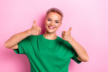 Photo of cheerful optimistic woman dressed green trendy clothes two hands thumbs up nice job isolated on pink color background