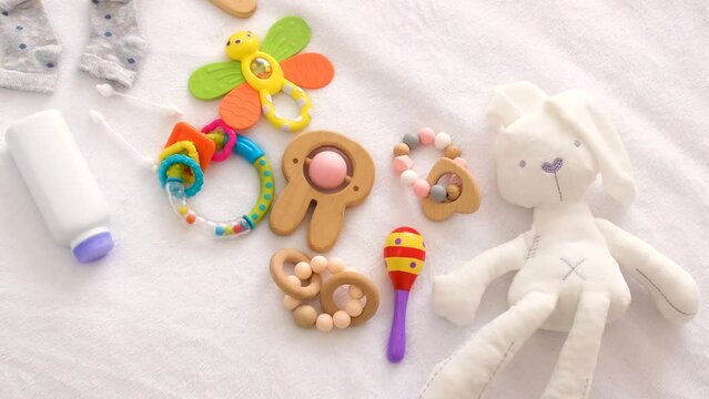 baby toys and accessories on the bed. selective focus.