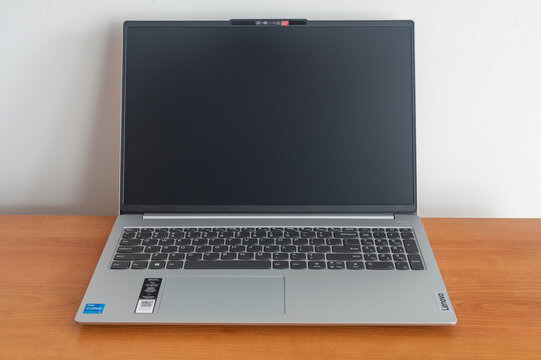 Pruszcz Gdanski - December 24, 2023: Open Lenovo laptop on wooden table.