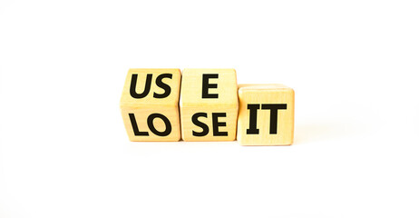 You use or lose it symbol. Concept word Use It or lose it on wooden cubes. Beautiful white table white background. Business and you use or lose it concept. Copy space.