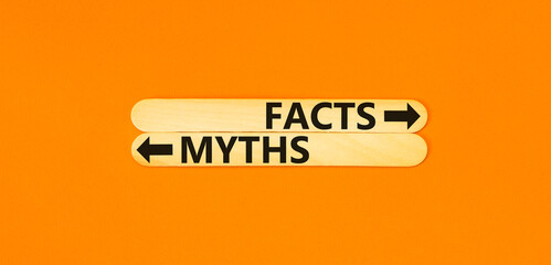 Facts or myths symbol. Concept word Myths and Facts on beautiful wooden stick. Beautiful orange...