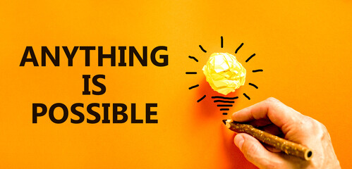 Anything is possible symbol. Concept words Anything is possible on beautiful orange paper....