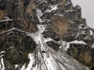 Fototapeta na wymiar rock and snow falling on Fanes mountain Dolomites winter panorama landscape