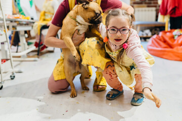 Cute little girl play with her dog