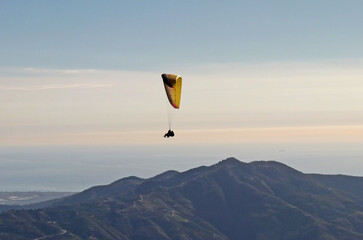 Tandem paraglider flying from Otivar, Spain