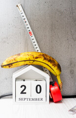 Weight loss concept, banana with meter for measuring waist. Banana with tape measure