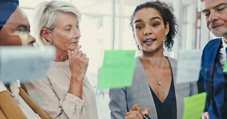 Meeting, coaching and sticky note with business woman talking to team in office for vision development. Collaboration, glass and seminar with employee group in workplace for strategy or game plan - Powered by Adobe