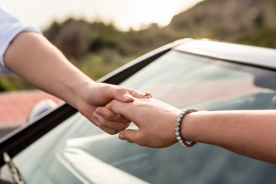 Male and female hands hold hand in hand, symbolizing family, love. Wedding, Valentine, love story,