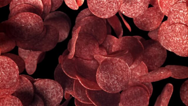 Sliced salami flies up and falls down. Filmed on a high-speed camera at 1000 fps. High quality FullHD footage