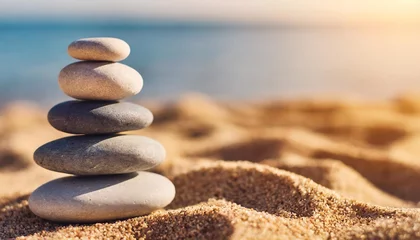 Fototapete stacked zen stones sand background art of balance concept banner © Susan