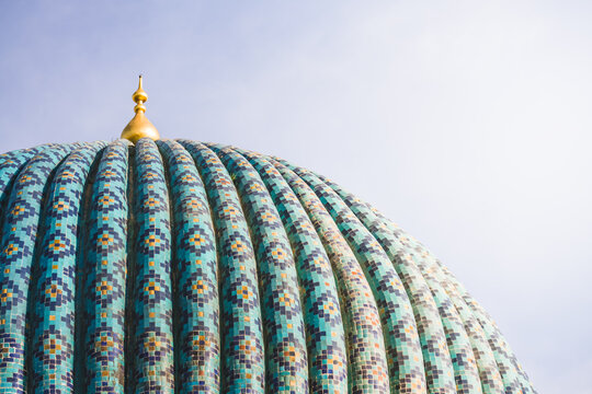 Blue domed roof of the Gur Emir mausoleum with mosaic in the ancient city of Samarkand in Uzbekistan, oriental architecture