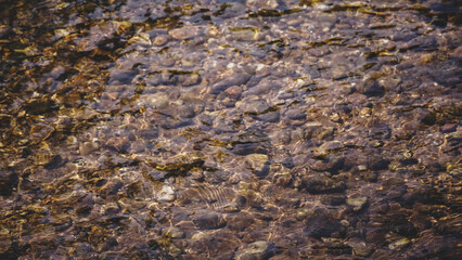 Rocks in clear river.Landscape with stream water and rock. Natural background. Nature wallpaper.Close up.
