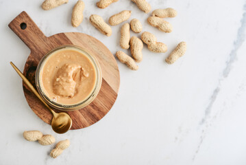 Creamy and smooth peanut butter in jar - 737484666