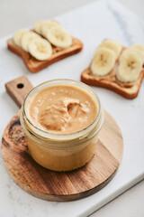 Obraz na płótnie Canvas Creamy and smooth peanut butter in jar