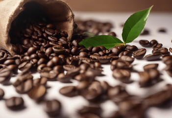 Obraz premium Delicious coffee beans with leaves on white table