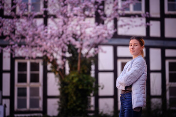 Serene Woman Enjoying Cherry Blossoms in Spring