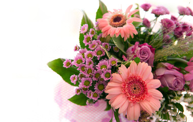 Colorful bouquet of pink flowers isolated on blur background.