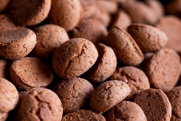 A portrait of a lot of tasty traditional dutch treats called pepernoten or pepernuts. The gingerbread snack is a tradition during the holidays and sinterklaas or saint nicholas.