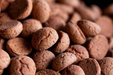 A portrait of a delicious dutch treat called pepernoten. Pepper nuts are a traditional cookie during holidays and saint nicholas or sinterklaas in dutch and it tastes like gingerbread.