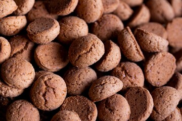 A delicious topdown portrait of a pile of tasty traditional dutch snacks called pepernoten or pepernuts. The gingerbread treat is a tradition during the holidays and sinterklaas or saint nicholas.
