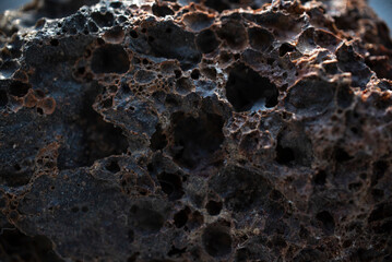 Stone surface background. Pumice stone its blurred natural background. Macro.