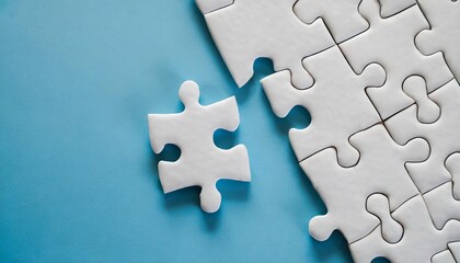 blank white jigsaw puzzle pieces on blue background