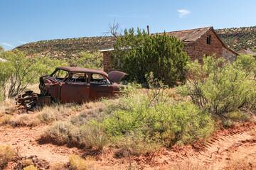 Old rusted out car and abandoned home on old Historic Route66 in New Mexico, USA.