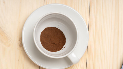 freeze-dried coffee, Instant coffee in white cup on wooden background, the view from top.