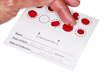 Blood Spot test card with droplets of blood for hormone testing