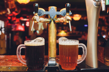 Close up of beer taps in row. Metallic equipment for bars and mini brewerys. Concept of modern...