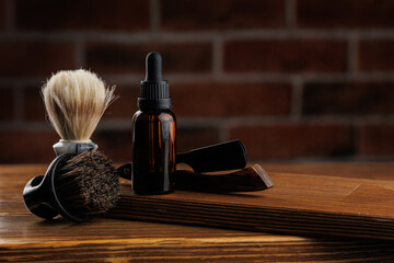 Bottle essential oil for beard men on background dark brick. Concept banner spa barbershop...