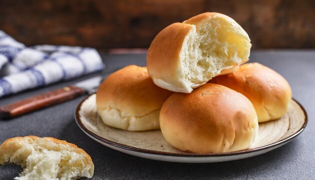soft white bread rolls placed on a plate