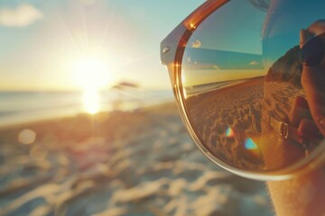 A clear image of a person's reflection in sunglasses on a beautiful beach. Perfect for travel brochures or lifestyle blogs