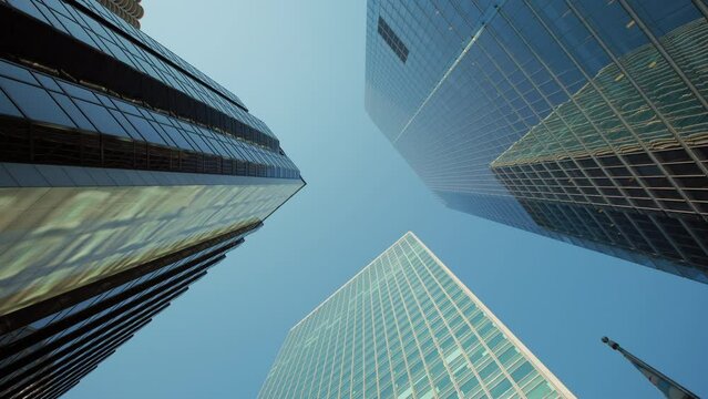 Urban skyscraper skyline with modern architecture and towering cityscape. Down to up shot