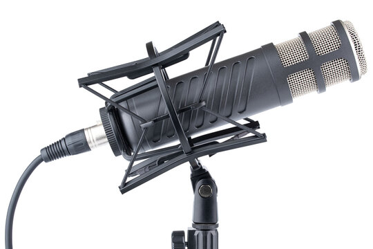 Microphone. Professional dynamic or condenser microphone. Radio broadcasting or podcast microphone with shock or anti vibration mount on stand. Mic without windshield. Recording voice, music or song